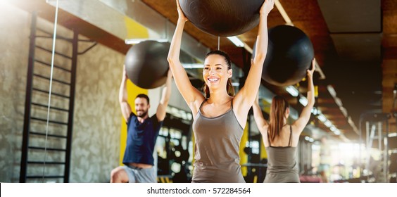 Exercising At Gym With Pilates Ball.