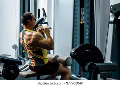 Exercising On Pull Down Weight Machine