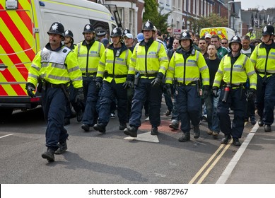 EXETER - APRIL 30: Devon And Cornwall Police Escort Football Fans To Prevent Football Violence At The League 1 Match Between Exeter City FC And Plymouth Argyle FC On April 30, 2011 In Exeter, UK.