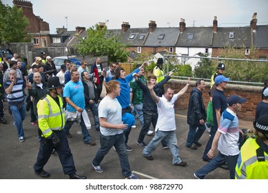 EXETER - APRIL 30: Devon And Cornwall Police Escort Football Fans To Prevent Football Violence At The League 1 Match Between Exeter City FC And Plymouth Argyle FC On April 30, 2011 In Exeter, UK.