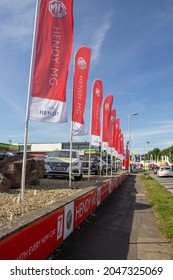 EXETER, DEVON, UK - SEPTEMBER 21, 2021 Flags At The Hendy Car Store Car Dealer, Marsh Barton Road On Marsh Barton Trading Estate