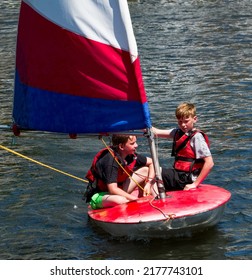 Exeter, Uk. July 11th 2022. Teenagers  Learning To Sail On Topper Sail Boats. Chatting Whilst On Their Boat With The School Trip. Some Vibrant Close Up Shots Of The Students Wearing Bright Life Jacket