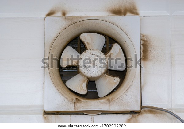 Exhaust Air Blower,\
Fan Exhaust Fan or Exhaust Kitchen Ventilator with dirty dust\
closeup. Selective\
focus