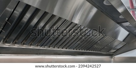 Exhaust hood, stainless steel showing grease baffles and filters and lights