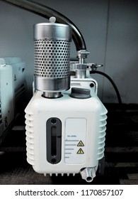 Exhaust Oil Mist Filter Attached On A Vaccuum Pump And Showing Oil Level In The Front. It Has Been Used With Many Laboratory Equipments And Industrial Instruments.