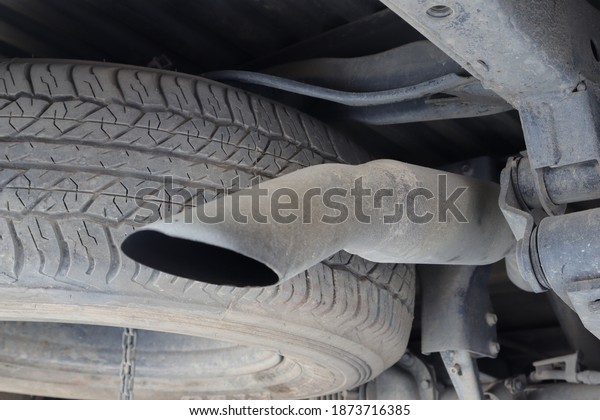 Exhaust pipe, which is
part of the car, The spare tire of the car is installed near the
exhaust pipe,