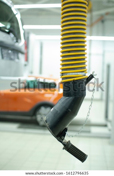 Exhaust system in the service station. Car\
maintenance at the service\
station.