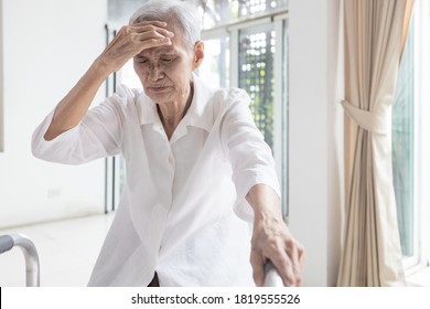 Exhausted Asian Senior Woman Is Touching Her Head With Hand,symptoms Of Vertigo Illness,loss Balance Dizzy,meniere’s Disease,feel Unwell Faint,sick Elderly People Having A  Headache,health Problem