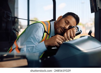 Exhausted bus driver napping in vehicle cabin. - Powered by Shutterstock