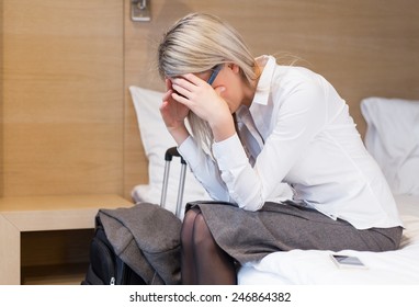 Exhausted Business Woman In Hotel Room