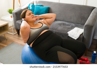 Exhausted Fat Woman Doing A Pilates Workout At Home. Tired Stressed Big Woman Exercising To Lose Weight