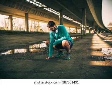 Exhausted man resting after jogging