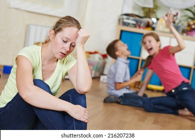 exhausted mother frustrated and upset from children behaviour