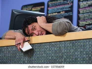 Exhausted Native American Restaurant Owner Laying On Counter