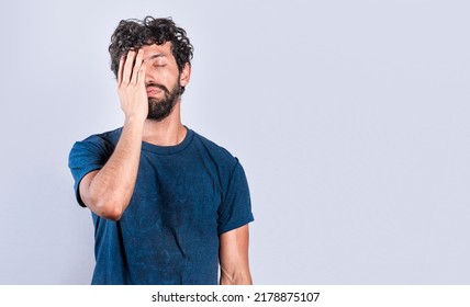 Exhausted person putting the palm of his hand on his face. Tired and exhausted man covering his face with the palm of his hand, Concept of a bored and tired man - Shutterstock ID 2178875107