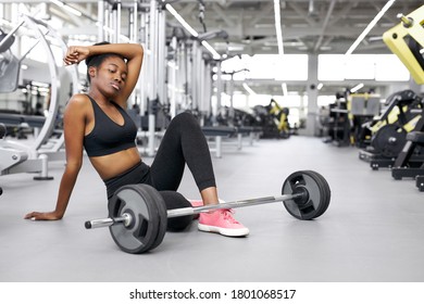 Exhausted Sweaty Woman Sit In Gym, Have Rest After Hard Weightlifting, Workout With Barbell