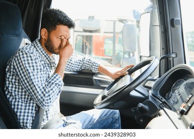 Exhausted truck driver falling asleep on steering wheel. Tiredness and sleeping concept. - Powered by Shutterstock