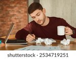 Exhausting Job. Overworked Employee Holding Coffee Cup Almost Sleeping At Workplace Indoor. Selective Focus