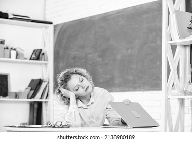 Exhausting lesson. Tired tutor fall asleep at workplace. Woman tired in school classroom. Teacher exhausted after hard working day. School pedagogue stressful occupation. Tired student lean on desk