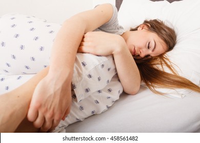 Exhaustion Relax Dreaming Sleep Concept. Tired Girl Sleeping. Young Lady Resting In Fetal Position Recovering In Bed.