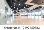 Exhibition blur background of convention hall event for business of tech expo, trade fair, passenger terminal or museum gallery lobby with blurry interior large corridor hallway white room empty space