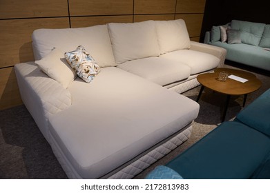 Exhibition Center With A Variety Of Stylish And Modern Sofas, Settees, Couches With Cushions, Pillows And Blankets In A Furniture Design Studio Living Room Interior Model