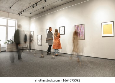 Exhibition In Modern Crowded Art Gallery