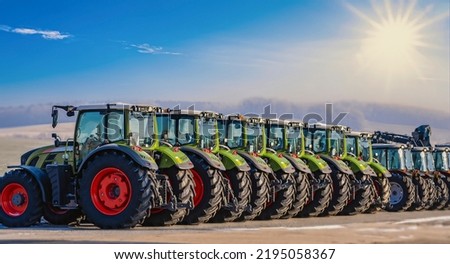 Exhibition - new tractors lined up next to each other in a row
