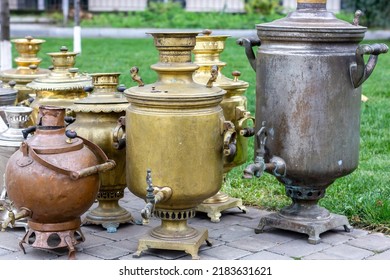 Exhibition of old-fashioned iron samovars. Bronze samovar.