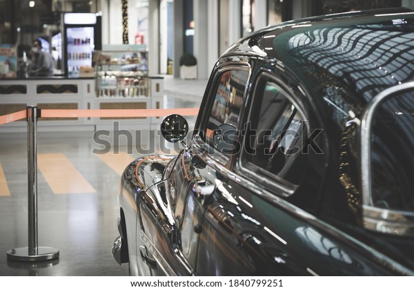 exhibition of retro cars. black shiny car.\
car restoration.