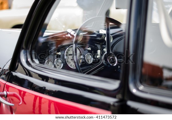 Exhibition of\
retro cars / Dashboard of retro\
car
