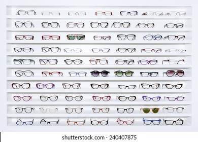exhibitor of glasses consisting of shelves of fashionable glasses shown on a wall at the optical shop 