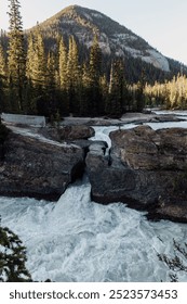 An exhilarating image capturing a wild river rushing through a narrow canyon surrounded by rugged, rocky outcroppings and lush greenery, highlighting the untamed force of nature.