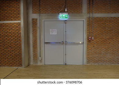 Exit door and brick wall - Powered by Shutterstock