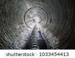 Exit from the drainage sewage tunnel pipe. Concrete Drainage Pipe, collector of city sewage system