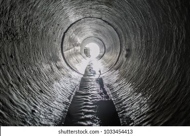 Exit from the drainage sewage tunnel pipe. Concrete Drainage Pipe, collector of city sewage system - Powered by Shutterstock