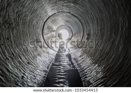 Exit from the drainage sewage tunnel pipe. Concrete Drainage Pipe, collector of city sewage system
