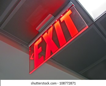 exit emergency sign inside of silver surface, rescue red led light, modern fire security diversity