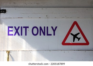 Exit Only Sign And Red Triangle Warning Sign Of Aircraft