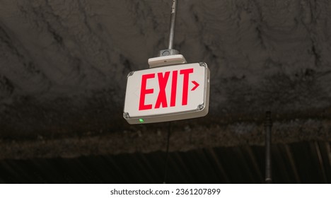 exit sign glows brightly, symbolizing safety and guidance in emergency situations in urban environments