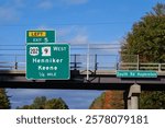 exit sign on  Interstate 89 for  Exit 5 for US-202 and NH-9 toward Henniker and Keene, New hampshire