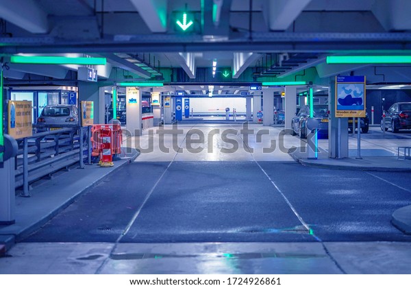 Exit from underground parking. Underground\
parking garage. Barrier at Entrance and exit of a car Parking\
garage. barrier in a car park. 30 August 2018. Amsterdam Schiphol\
Airport. Netherlands.