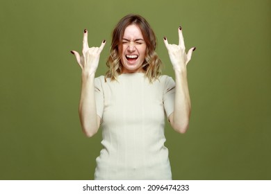 Exited Cool Young Woman Show Rock N Roll Gesture By Raised Hands, Screaming. Female Rocker Music Fan Celebrate Success