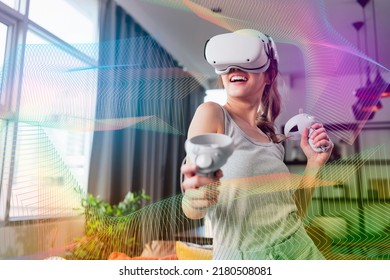 exitied enjoy 3d virtual gaming futuristic experience young asian female wear vr headset technology watching simulation digital world hand gesture control herself to beat the online fun virtual gaming - Powered by Shutterstock