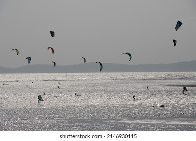 Exmouth, Devon, UK - March 22 2022: Kite Surfers On The Beach At Exmouth