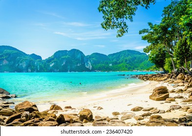Exotic beach with blue sky, blue water and white sand in the background, South Asia