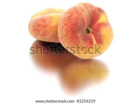 Exotic flat peach on a white background with water drop