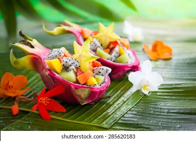 Exotic fruit salad served in half a dragon fruit - Shutterstock ID 285620183
