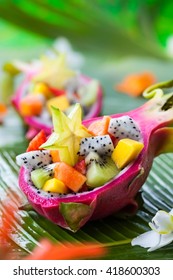 Exotic fruit salad served in half a dragon fruit - Shutterstock ID 418600303