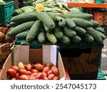 Exotic fruits on the market, these are 
Monstera deliciosa (Swiss Cheese plant) and Passiflora ligularis (passion fruit).